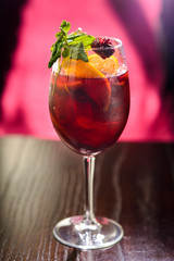 wine cocktail with mint garnish.