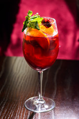 wine cocktail with mint garnish.