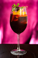 wine cocktail with mint garnish.