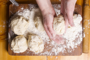 Making dough by female hands