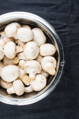champignons in a metal bowl