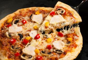 pizza on the board with ham