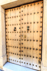 Wooden door in the old town of Ronda, Andalusia, Spain
