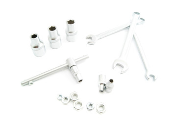 metal heads and wrenches on white