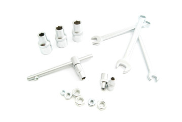 iron heads and wrenches on white