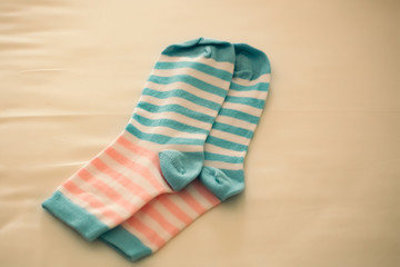 Striped socks on beige backdrop