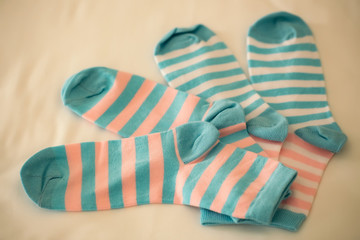 Striped socks on beige backdrop