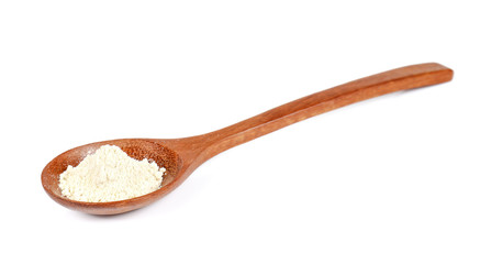 Milk powder,Whey Protein in wooden spoon on white background.
