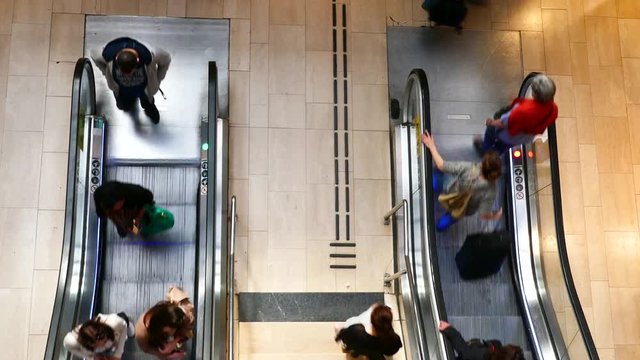 STOCKHOLM, SWEDEN, APR 2016: High angel top view of crowd of people going up and down on a escalator