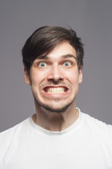 Obraz premium Crazy man showing his teeth.