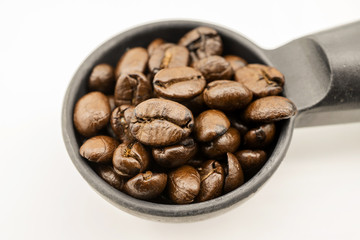 close up coffee beans in portafilter