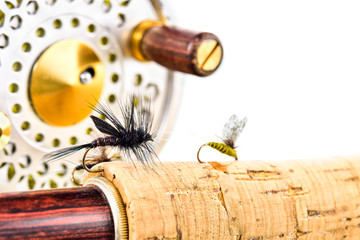 Close up of fly fishing rod and reel on white background