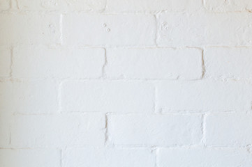 Imperfect interior white painted brick wall background