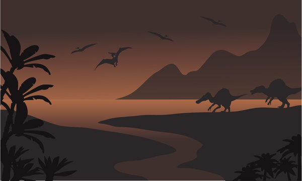 Silhouette of spinosaurus in riverbank and pterodactyl