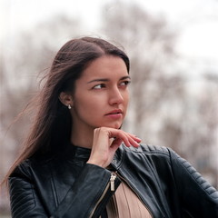 Fashion beautiful brunette woman wearing a rock black leather