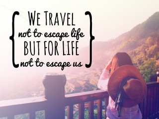 Inspirational quote "we travel not to escape life" on blurred background with vintage filter