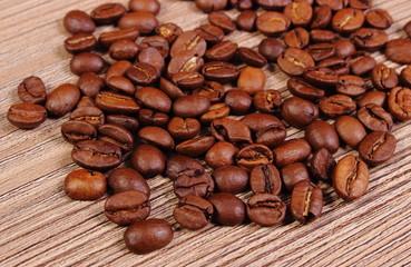 Heap of coffee on wooden background