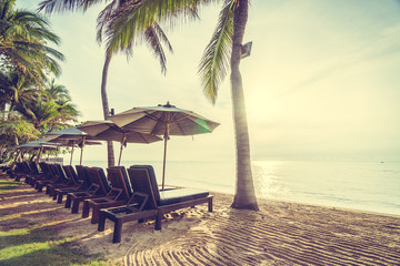 Beautiful coconut palm tree on the beach and sea
