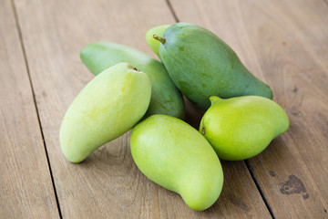 Green Mango on a wooden table