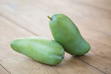 Green Mango on a wooden table