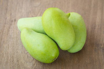 Green Mango on a wooden table