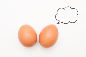 Talking food: two eggs with comic label
