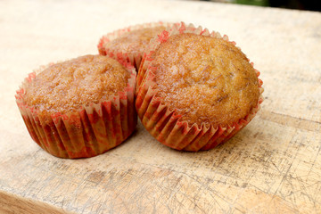 cupcakes with fruit filling on cutting board.