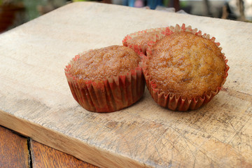 cupcakes with fruit filling on cutting board.