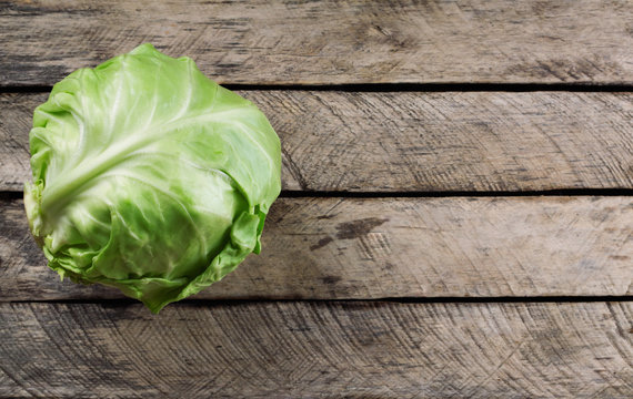 cabbage on old wooden table top view with copy space