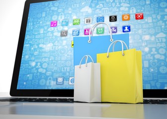 laptop and  shopping pags on white background. 3d rendering.