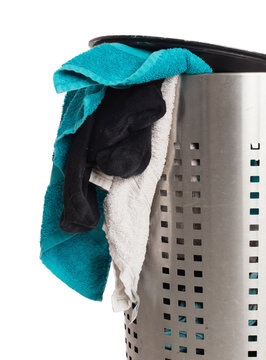 Dirty laundry in a metal basket