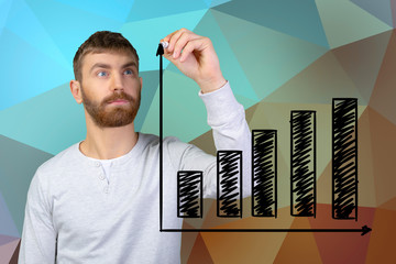 young man drawing graph on the virtual screen