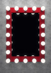 Red makeup mirror on the concrete wall
