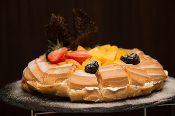 Profiteroles with fresh mango