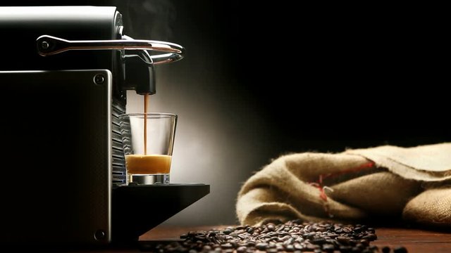 Modern and elegant coffee machine making italian espresso 