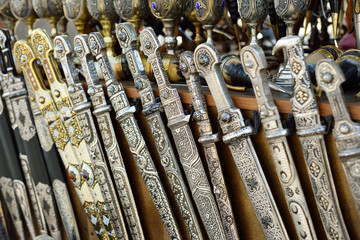 Georgian souvenirs. Swords, knives and handmade cups. Souvenir c