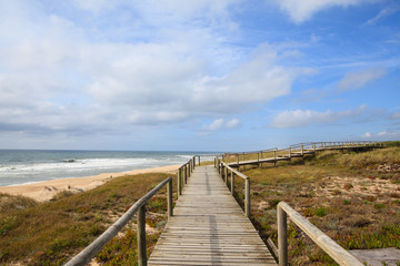 Landscape of portuguese beach with wooden walkway, Portugal