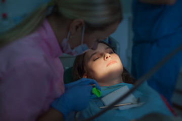 Girl patient at a reception at the dentist.