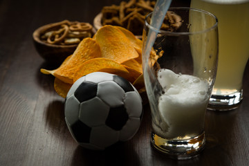 Pouring bear into glass, party snacks