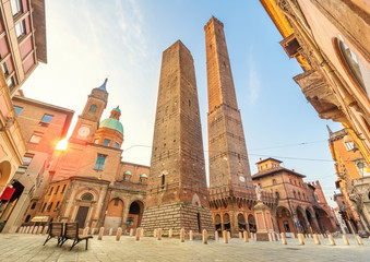 Two famous falling towers Asinelli and Garisenda in the morning, Bologna, Emilia-Romagna, Italy - obrazy, fototapety, plakaty
