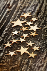 Close-up of wooden stars on tree bark