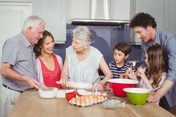 Happy family cooking food in kitchen