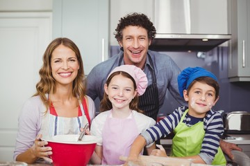 Portrait of happy family in kitchen