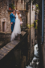 Newlyweds in old courtyard