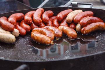 Street food. Sausages fried
