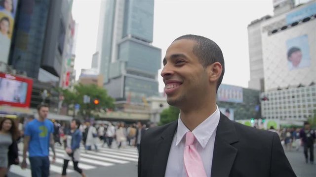 Handsom International mixed race Busines man felling succes in Tokyo Shibuya crossing Japan