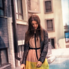 Fashion beautiful brunette woman wearing a rock black leather