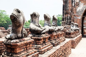 Fototapeta na wymiar broken buddha statue in Ayutthaya historical park