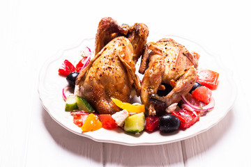 Baked quail with salad