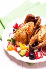 Baked quail with salad
